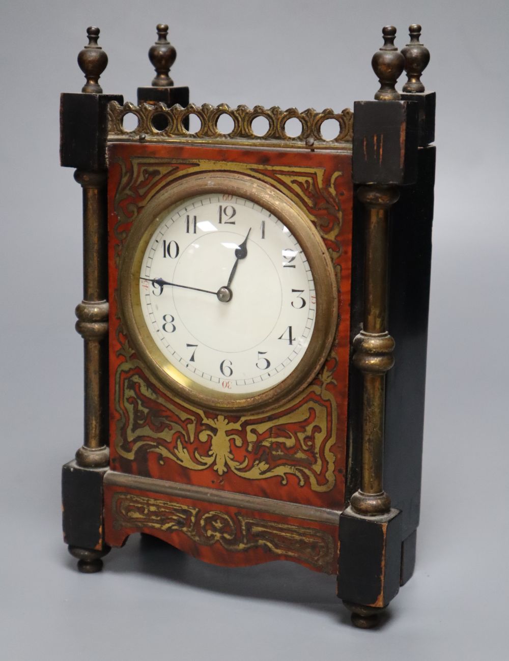 A small 19th century French timepiece, of rectangular form with ebonised and boulle work case and gilt brass mounts, integral key, heig